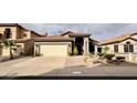 Charming single-Gathering home with a tile roof, desert landscaping, and a two-car garage at 14345 N 101St St, Scottsdale, AZ 85260