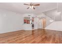 Bright living room features hardwood floors, stairs and an adjacent kitchen at 16 W Encanto Blvd # 26, Phoenix, AZ 85003