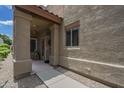 Inviting covered porch with decorative pillars and manicured landscape at 1650 S Crismon Rd # 63, Mesa, AZ 85209