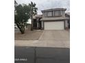 Charming two-story home featuring an attached two-car garage and desert landscaping at 1655 W Stanford Ave, Gilbert, AZ 85233