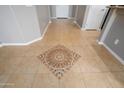 Close-up of the tile flooring, showcasing a decorative medallion inset in the home's foyer at 21532 N 262Nd Ln, Buckeye, AZ 85396