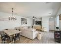 Open-concept living room boasting ample space, stylish decor, and abundant natural light for gatherings at 3893 E Gideon Way, Gilbert, AZ 85296