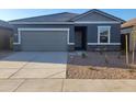 Charming single-story home with a gray exterior, gray roof, stone accents, and low maintenance desert landscaping at 4220 E Kolin Ln, San Tan Valley, AZ 85143