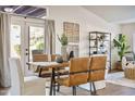 Inviting dining area with a modern table, chairs, and natural light at 4220 E San Angelo Ave, Gilbert, AZ 85234