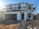 Two story home under construction with stacked roofing tiles and a two-car garage at 4248 E Kolin Ln, San Tan Valley, AZ 85143