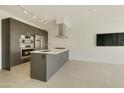 Bright, open kitchen with stainless steel appliances, a gas cooktop, and a sleek, modern design at 7120 E Kierland Blvd # 316, Scottsdale, AZ 85254