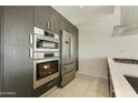 Close-up of a modern kitchen with stainless steel appliances, sleek cabinetry, and a clean design at 7120 E Kierland Blvd # 316, Scottsdale, AZ 85254