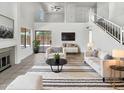 Bright living room with vaulted ceilings, fireplace, and open floor plan at 8831 N 63Rd Dr, Glendale, AZ 85302