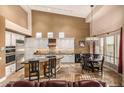 Gourmet kitchen with stainless steel appliances and a breakfast nook at 11124 N 138Th Way, Scottsdale, AZ 85259