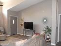 Open living room features vaulted ceilings and neutral paint at 1333 N Higley Rd # 7, Mesa, AZ 85205