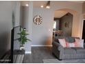 Bright living room features wood-look floors and neutral paint at 1333 N Higley Rd # 7, Mesa, AZ 85205