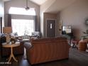 Inviting living room with high ceilings, large window, and comfortable seating at 1333 N Higley Rd # 7, Mesa, AZ 85205