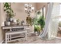 Dining room with writing desk, bench seating, and lots of houseplants at 1633 E Lakeside Dr # 156, Gilbert, AZ 85234