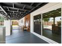 Relaxing covered patio with outdoor seating, offering a view of the backyard and pool at 1713 W Royal Palm Rd, Phoenix, AZ 85021