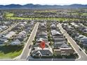 Aerial view of a home in a residential neighborhood, showcasing the community layout with mountain views at 17146 W Mountainair St, Surprise, AZ 85388