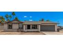 Charming single-story home with an attached garage and desert landscaping at 17201 N 35Th Dr, Glendale, AZ 85308