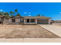 Charming single-story home featuring a spacious driveway and a two-car garage, perfect for comfortable living at 17201 N 35Th Dr, Glendale, AZ 85308