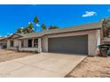 Charming single-story home featuring a spacious driveway and a two-car garage, perfect for comfortable living at 17201 N 35Th Dr, Glendale, AZ 85308