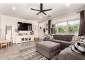 Comfortable living room featuring a shiplap accent wall, large sectional sofa, and natural light at 1882 S Jesse Pl, Chandler, AZ 85286