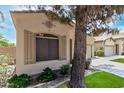 Close-up of home exterior featuring decorative shutters and a manicured lawn at 1887 W Periwinkle Way, Chandler, AZ 85248