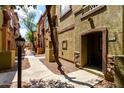 Charming condo with well-maintained landscaping, a well-lit walkway, and convenient access to unit at 1920 E Bell Rd # 1189, Phoenix, AZ 85022