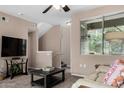 Cozy living room showcases a plush sofa, modern TV, and seamless transition to the staircase at 1920 E Bell Rd # 1189, Phoenix, AZ 85022