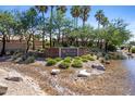 Westbrook Village entrance with stone sign, water feature, and lush landscaping at 19530 N 84Th Ave, Peoria, AZ 85382