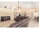 Spacious living area featuring a ceiling fan, recessed lighting, and tiled floors at 251 E Arabian Dr, Gilbert, AZ 85296