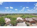 Panoramic aerial view of a residential neighborhood, showcasing lush green space nearby at 3586 S Moccasin Trl, Gilbert, AZ 85297