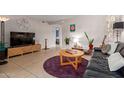 Cozy living room featuring modern decor, tile flooring, and comfortable seating at 541 N Lesueur St, Mesa, AZ 85203