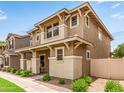 Charming two-story home with a welcoming front porch, complemented by lush landscaping and neighborhood street at 5840 E Holmes Ave, Mesa, AZ 85206