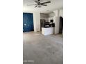 Open kitchen featuring stainless steel appliances and black countertops at 7325 W Wilshire Dr, Phoenix, AZ 85035
