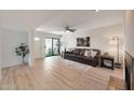 Bright living room with an open floor plan and a sliding glass door to the patio at 850 S River Dr # 1047, Tempe, AZ 85281