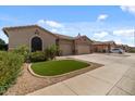 Charming single-story home with a well-manicured lawn and a spacious two-car garage, perfect for comfortable living at 10033 W Jessie Ln, Peoria, AZ 85383