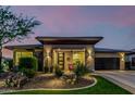 Charming single-story home with desert landscaping and a cozy covered front porch at 13252 W Steed Ridge Rd, Peoria, AZ 85383