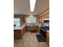 Modern kitchen features granite countertops, stainless steel appliances, and updated lighting at 1616 W Temple St, Chandler, AZ 85224