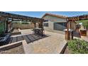 Private backyard featuring a pergola-covered patio, perfect for outdoor entertaining at 17421 N 14Th St, Phoenix, AZ 85022