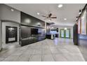 Open concept living room with tile floors, built-in shelving, and modern finishes at 17421 N 14Th St, Phoenix, AZ 85022