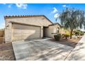 Charming single-story home featuring a neutral color scheme, low maintenance landscaping, and attached two car garage at 1747 E Grove St, Phoenix, AZ 85040