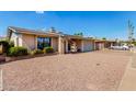 Charming single-story home with a well-maintained front yard and a two-car garage at 1802 W Isleta Ave, Mesa, AZ 85202