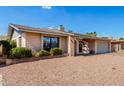 Charming single-story home with a well-maintained front yard and a two-car garage at 1802 W Isleta Ave, Mesa, AZ 85202