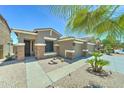 Charming single-story home featuring a well-manicured front yard with desert landscaping at 18195 W Marshall Ln, Surprise, AZ 85388