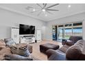 Comfortable living room with patio access, a large television, and stylish furnishings for relaxation and entertainment at 18493 W Hiddenview Dr, Goodyear, AZ 85338