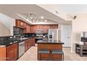 Modern kitchen offers stainless appliances, ample cabinet space, and a convenient island with bar seating at 2401 E Rio Salado Pkwy # 1192, Tempe, AZ 85288