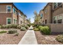 Community street view showcasing well-maintained landscaping and attractive exterior architecture at 2631 S Sulley Dr # 106, Gilbert, AZ 85295