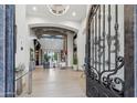 Grand foyer showcasing open-concept design, high ceilings with wood beams, and an elegant chandelier at 2748 E Warbler Rd, Gilbert, AZ 85297