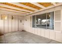 Charming covered porch with exposed wood and an inviting entry to the home at 3410 W Pershing Ave, Phoenix, AZ 85029