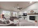 Cozy living room features a fireplace, built-in shelves, and a comfortable sofa, creating a relaxing atmosphere at 3523 W Buckhorn Trl, Phoenix, AZ 85083