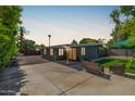 Backyard featuring gravel, artificial grass, and comfortable outdoor furniture at 5739 N 11Th St, Phoenix, AZ 85014