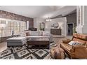 Open-concept living room showcasing hardwood floors, stylish decor, and ample natural light, perfect for relaxing at 650 E Silver Creek Rd, Gilbert, AZ 85296